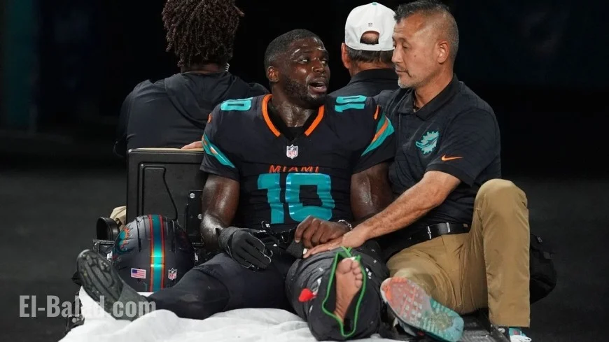 Dolphins Star Hill Exits Game with Left Knee Injury in Air Cast