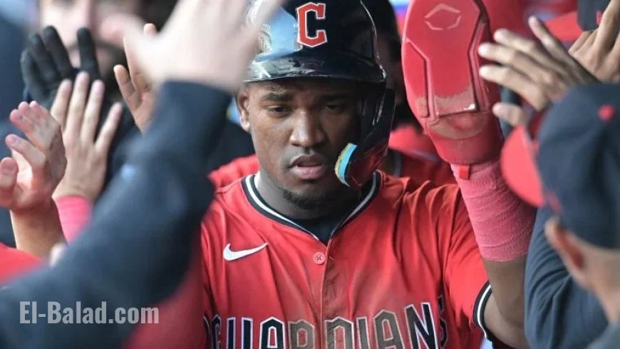 Angel Martinez of the Guardians breaks camera lens on field during Tigers playoff game