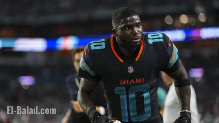 Tyreek Hill Rejoins Dolphins, Addresses Team at Facility