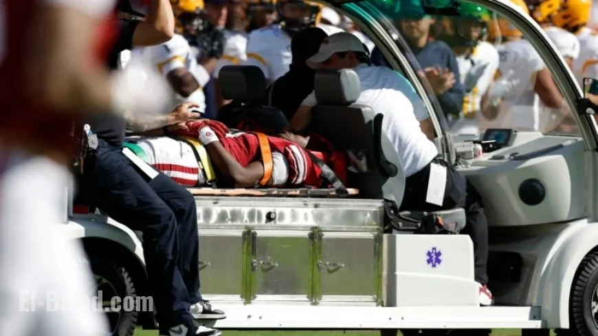 Oklahoma WR Lewis Suffers Injury in Headfirst Collision with Brick Barrier