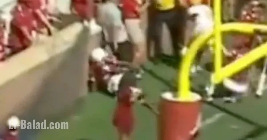 Football Player Injured in Collision with Brick Wall During Game