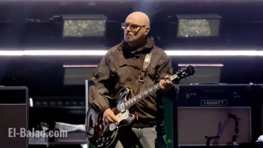 Oasis Guitarist Paul Arthurs Pauses Tour for Cancer Treatment